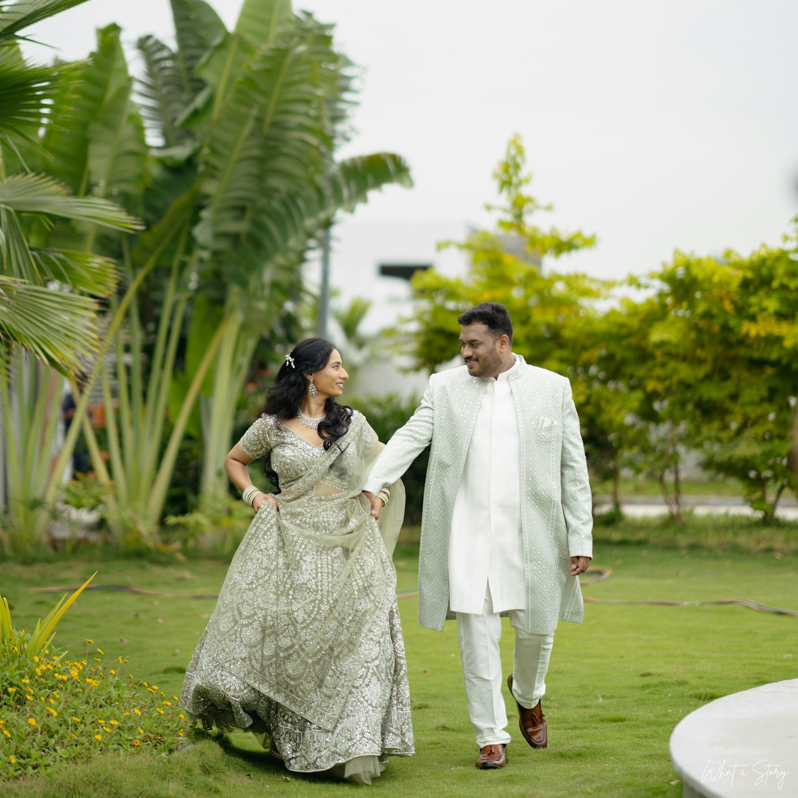 A couple walking through a garden together