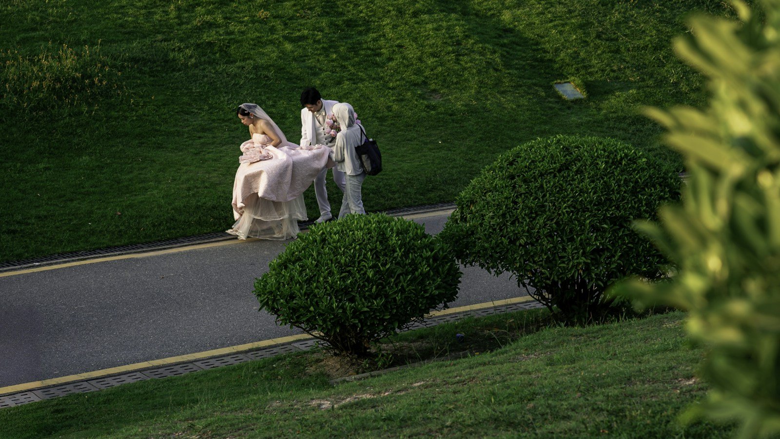A couple taking a quiet walk through green gardens
